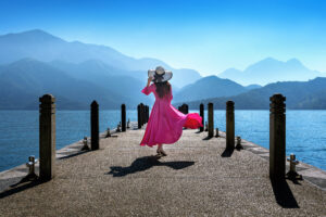 Beautiful girl walking at Sun Moon Lake in Taiwan.