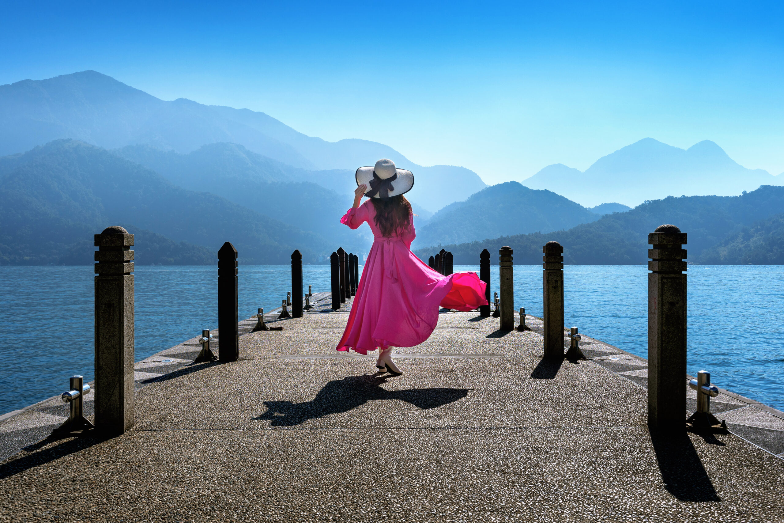 Beautiful girl walking at Sun Moon Lake in Taiwan.