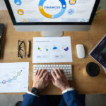 person-office-analyzing-checking-finance-graphs